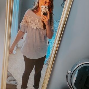 Baby blue and white top with lace accent.